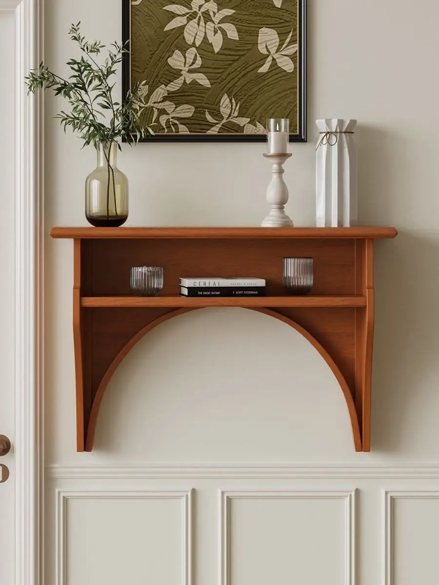 arched wall-mounted display console shown with surrounding furniture for scale