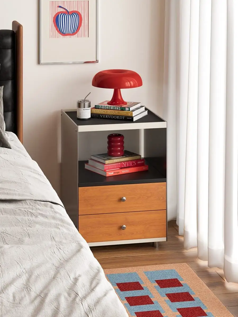 Front view of the nightstand's walnut drawers and open shelf
