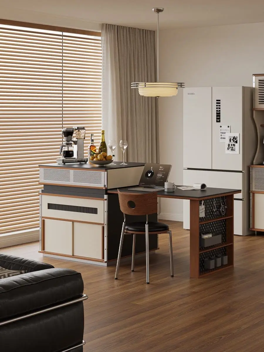 Kitchen island framed by pale cabinetry and soft daylight