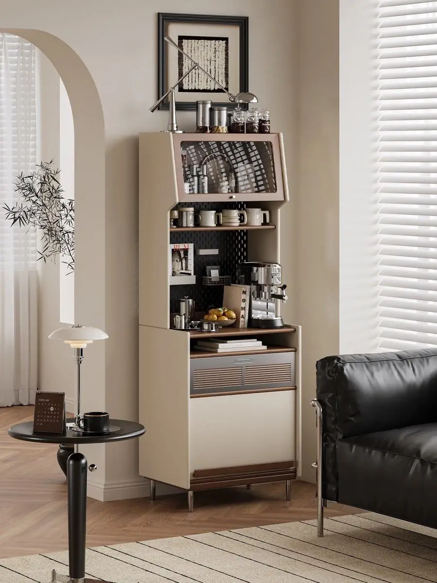 freestanding vertical coffee station cabinet shown with surrounding furniture for scale