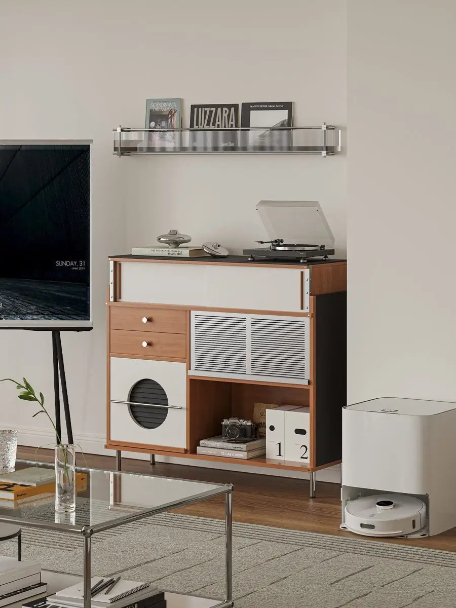 Broad cream and walnut cabinet with a circular bay and perforated fronts