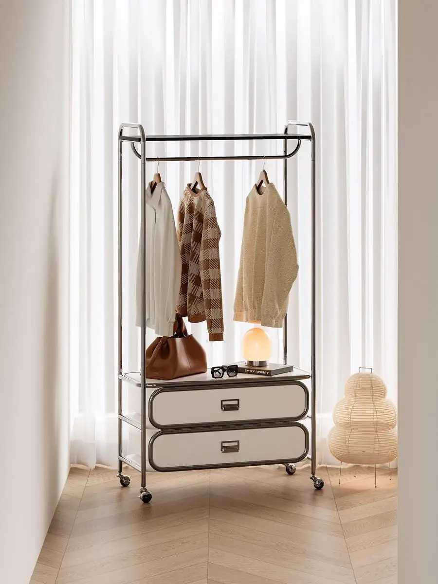 mobile tubular garment rack with drawers presented in a styled residential interior