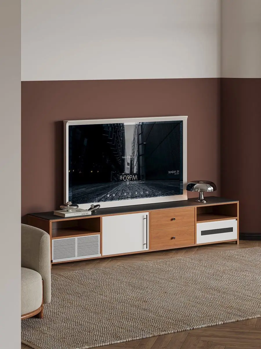 Media console staged with a sofa and warm ambient lighting