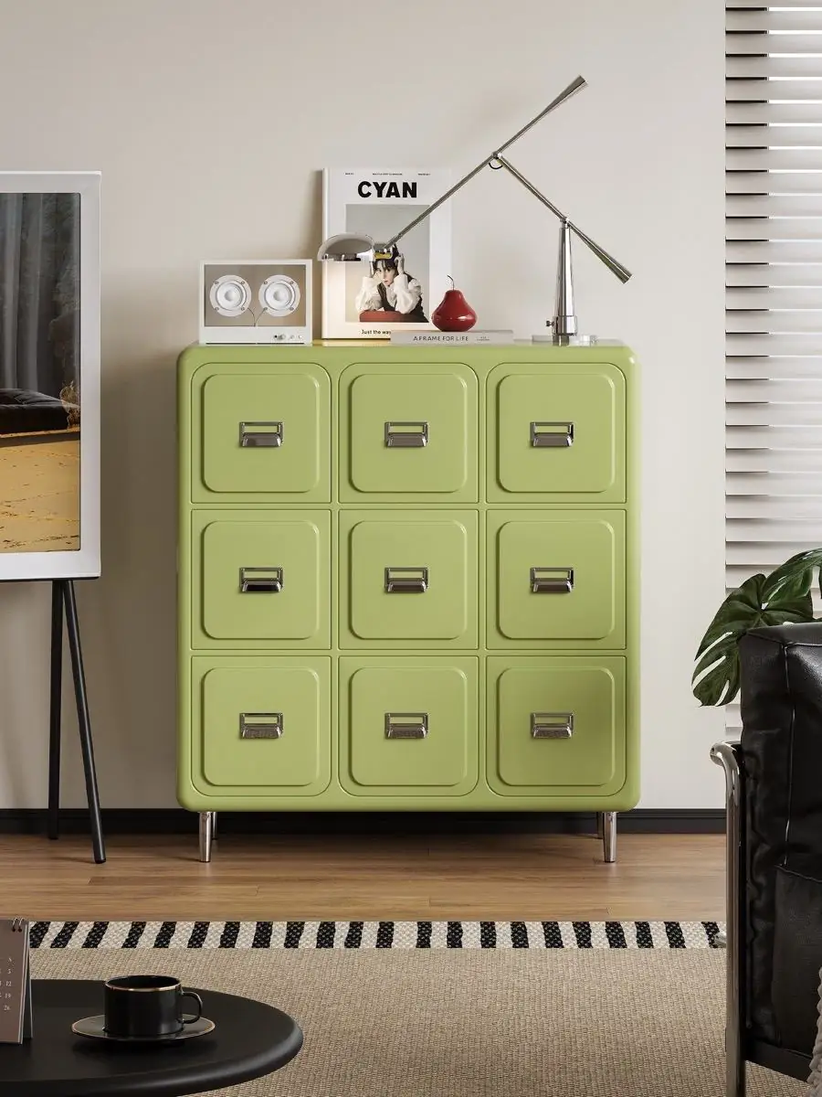 nine-drawer storage cabinet shown with surrounding furniture for scale