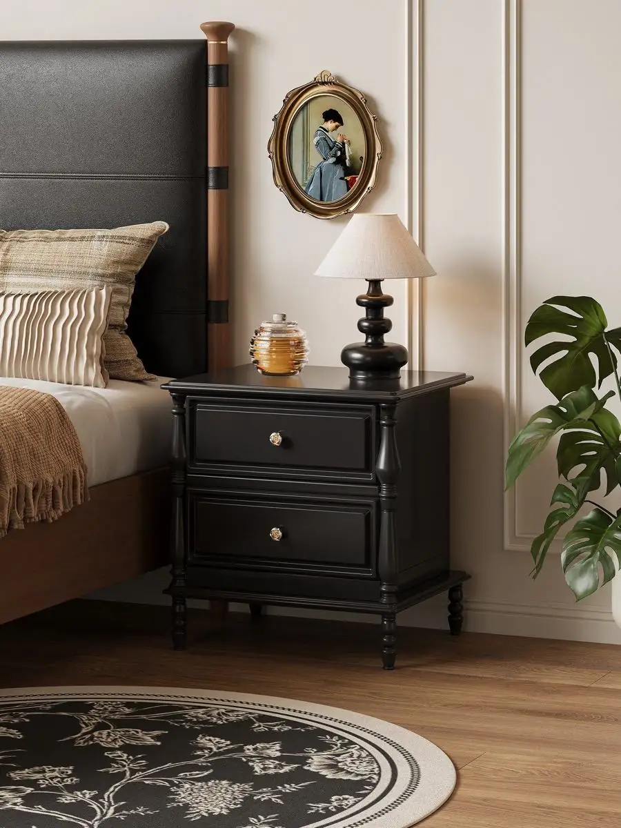 Closer product view of the black classical-detail bedside cabinet