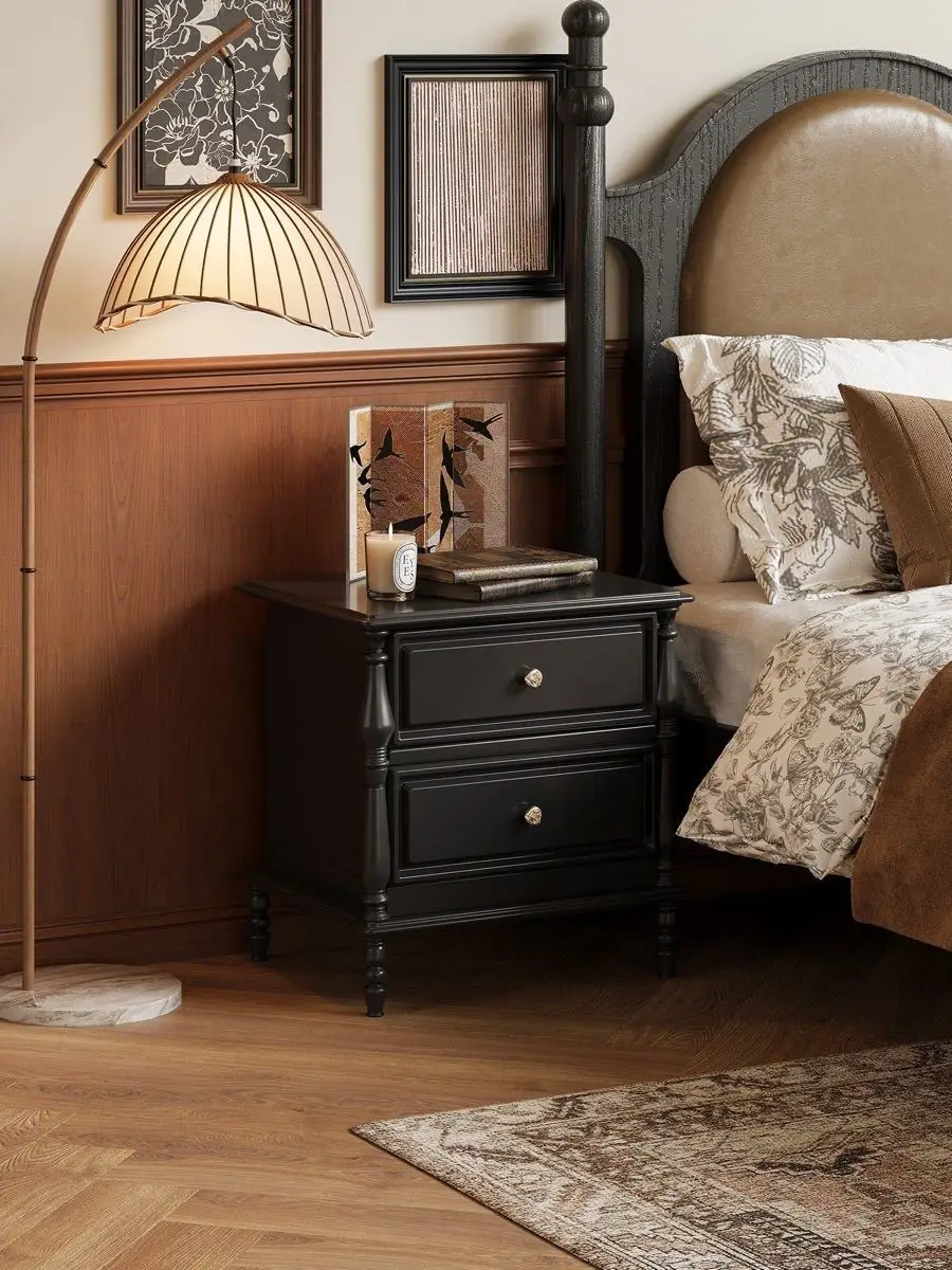black classical-detail bedside cabinet shown in a second interior setting