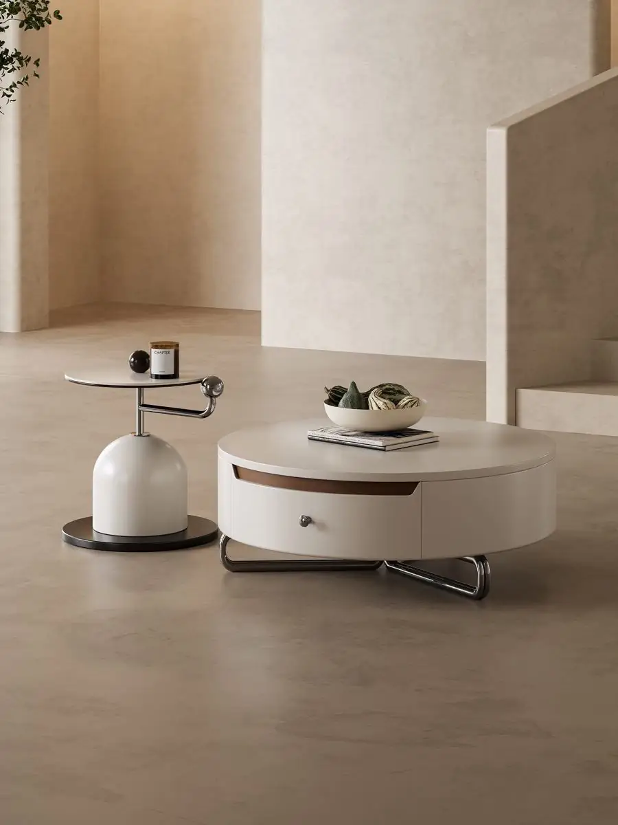 Cream storage coffee table and matching side table in a softly lit lounge