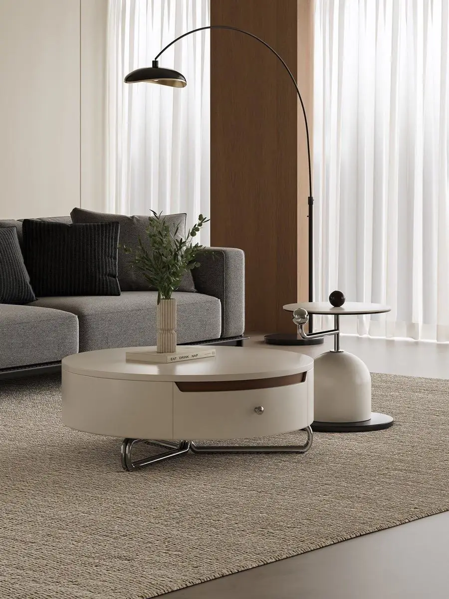 Low cream table set positioned beneath horizontal blinds in a neutral room
