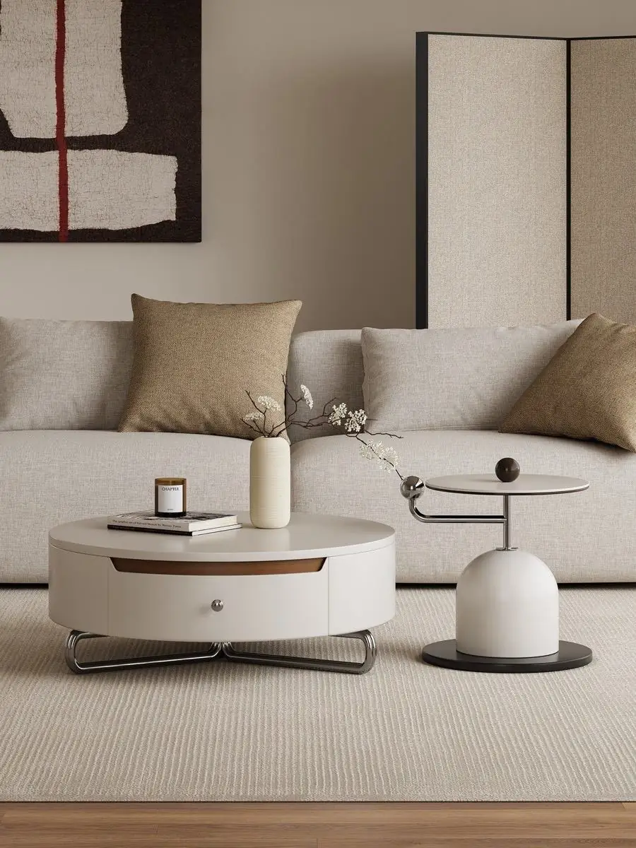 Round storage table and side table staged in a minimal architectural space