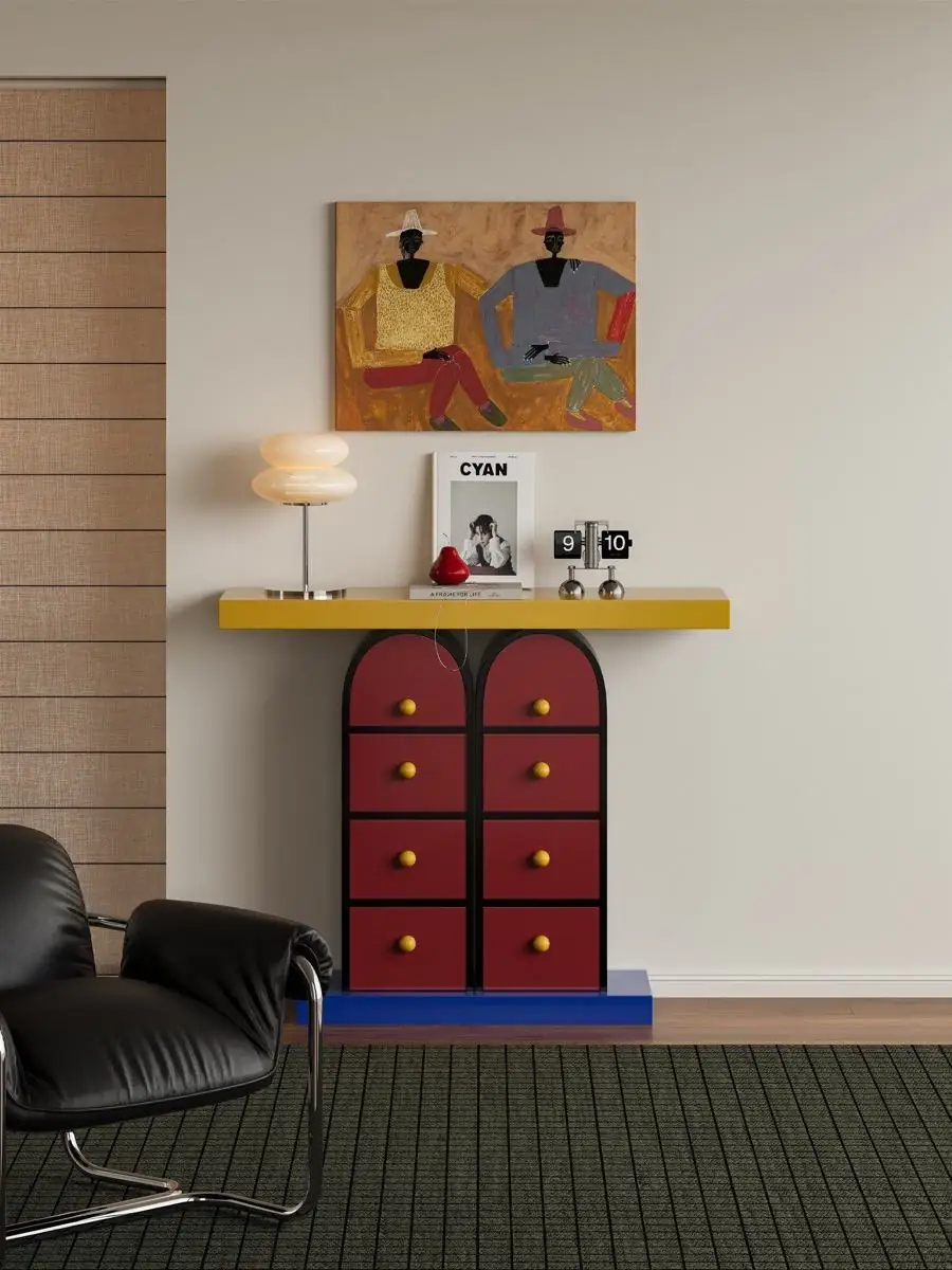 Memphis-style multicolour drawer console shown in a second interior setting