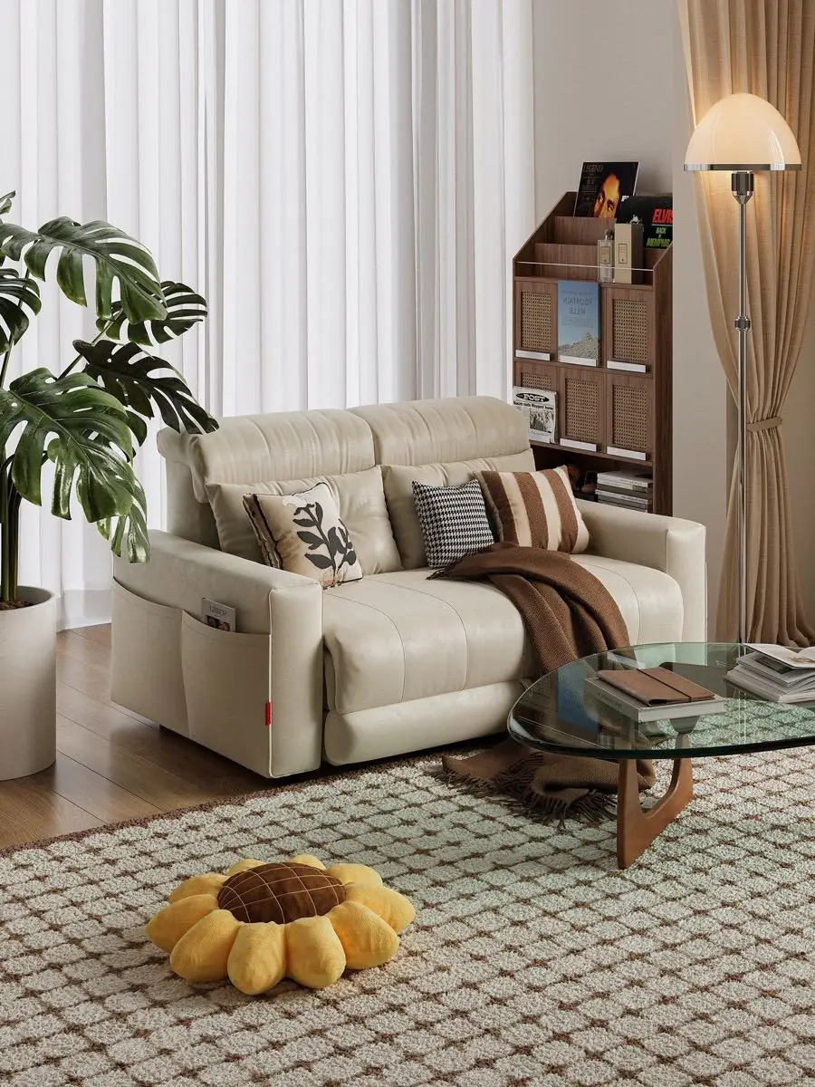 Front view of the dark loveseat in a bright open-plan lounge