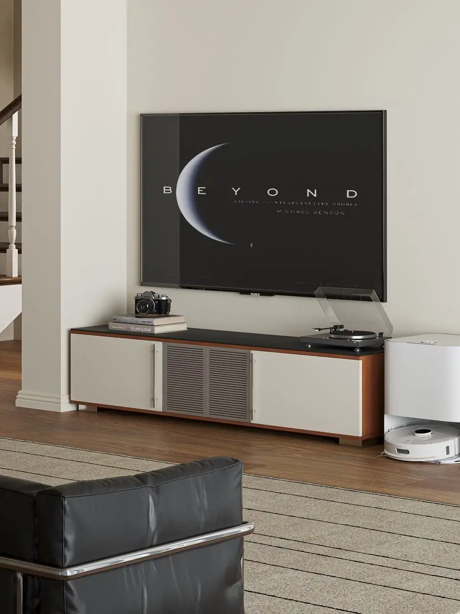 Media console styled beneath a wall-mounted television