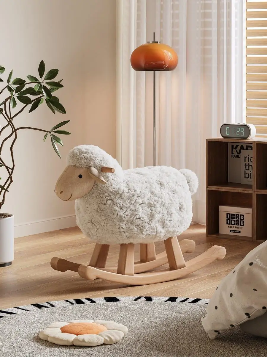 Three-quarter view of a fleece rocking chair in a neutral living room