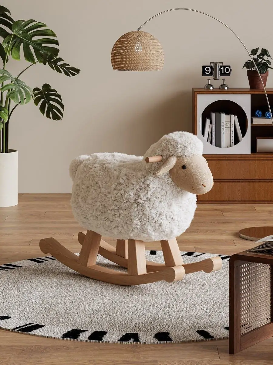 Lamb rocking chair centred on a rug in front of a media cabinet