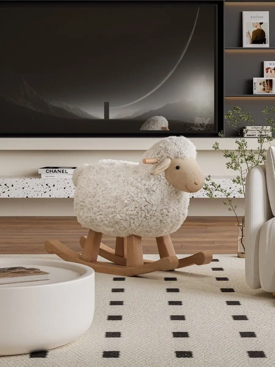 Side view of the rocking chair beside a low table and television wall
