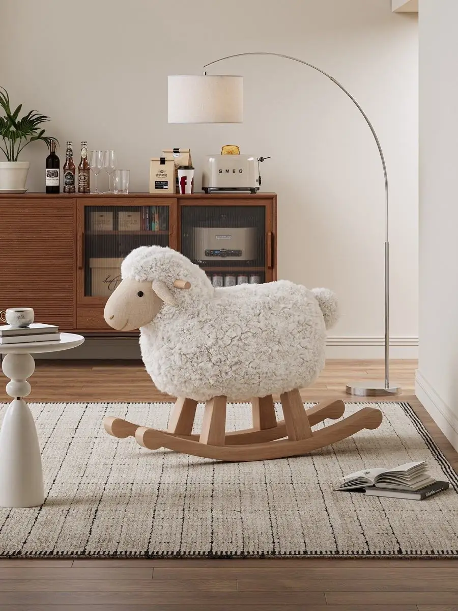 Fleece rocking chair placed near a timber sideboard in a bright interior
