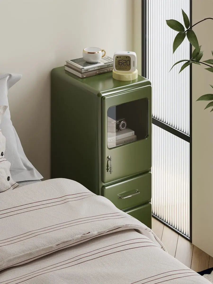 rounded painted-metal bedside cabinet presented in a styled residential interior