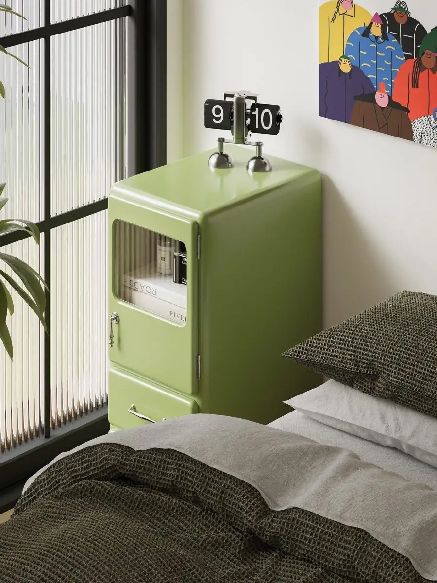 Alternate room view of the rounded painted-metal bedside cabinet