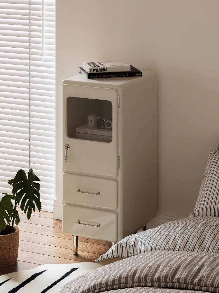 rounded painted-metal bedside cabinet shown in a second interior setting