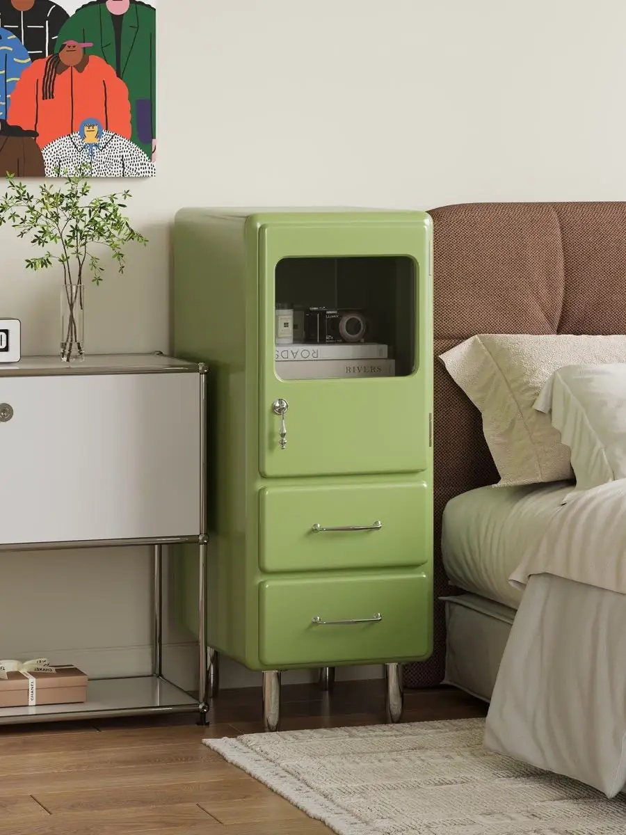rounded painted-metal bedside cabinet shown with surrounding furniture for scale