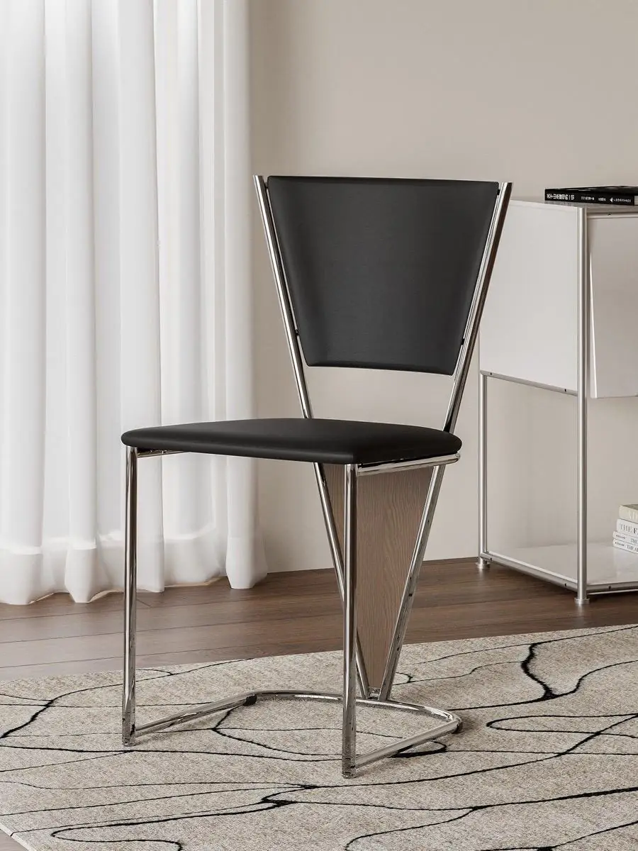 Closer product view of the polished tubular-frame black dining chair