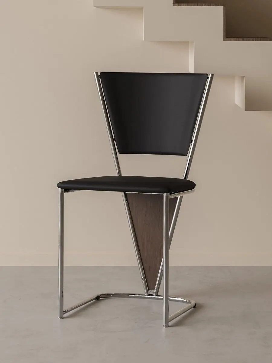 Material and form study of the polished tubular-frame black dining chair