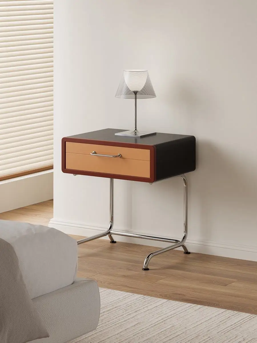 colour-blocked tubular-frame nightstand shown with surrounding furniture for scale