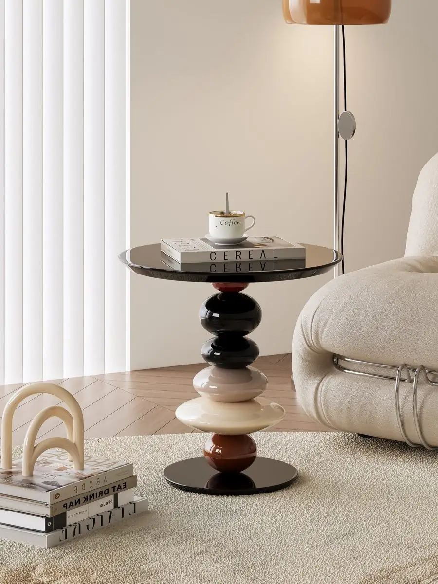 Side table staged beside lounge seating
