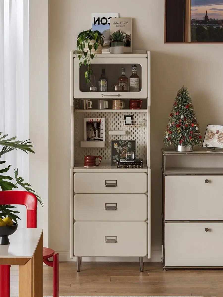 tall vertical beverage station cabinet shown with surrounding furniture for scale