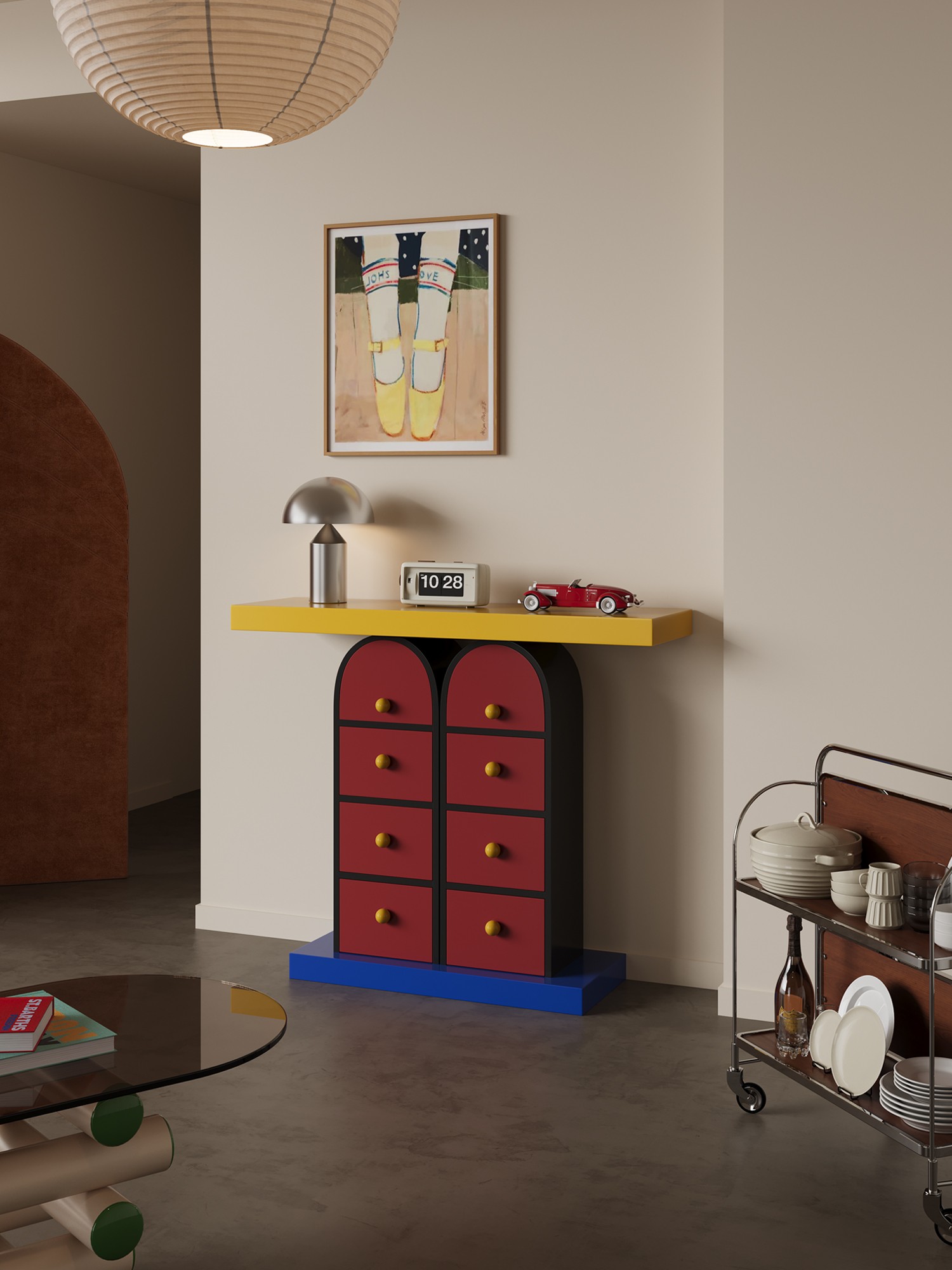Memphis-style multicolour drawer console shown with surrounding furniture for scale
