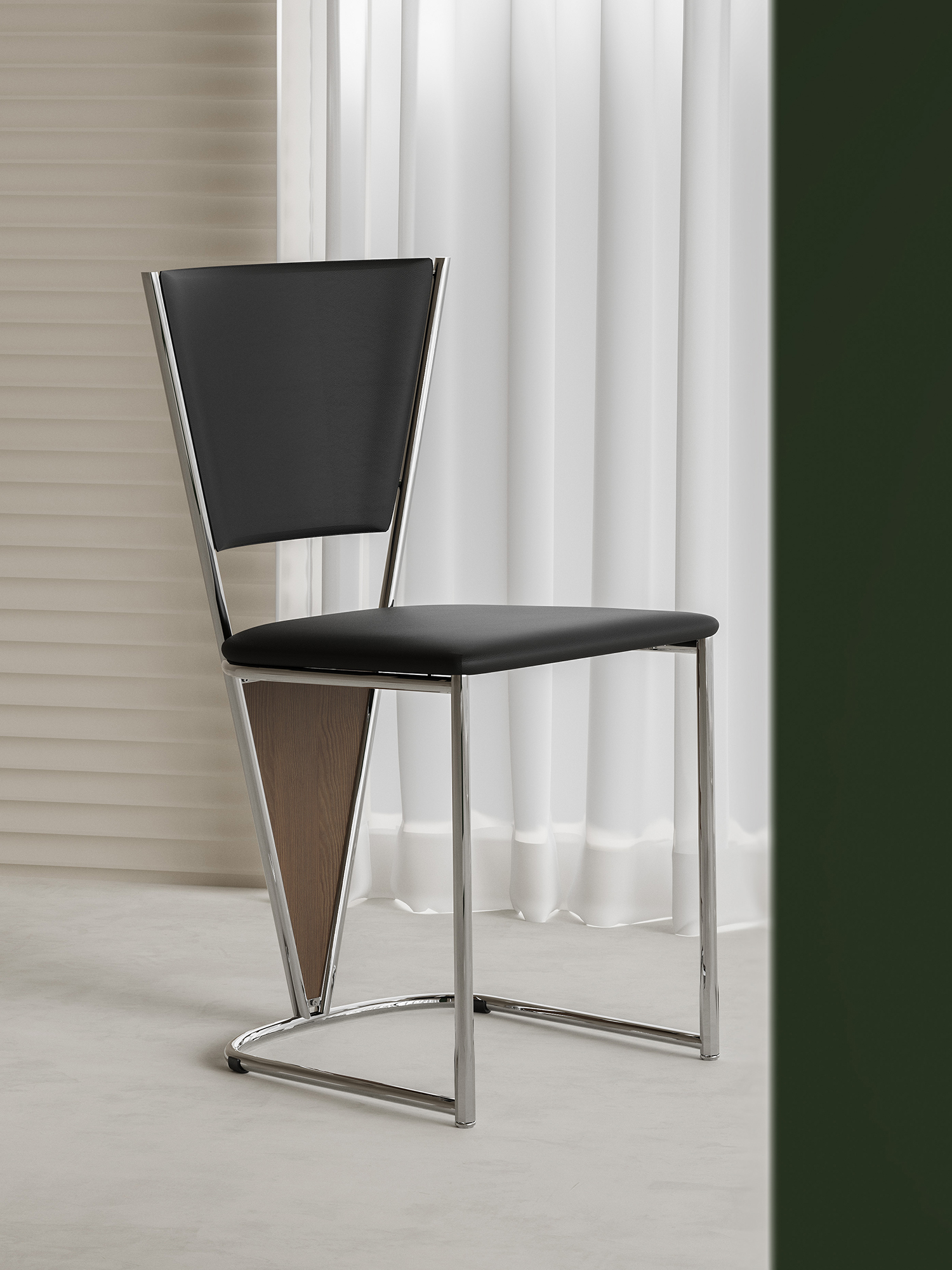 polished tubular-frame black dining chair presented in a styled residential interior